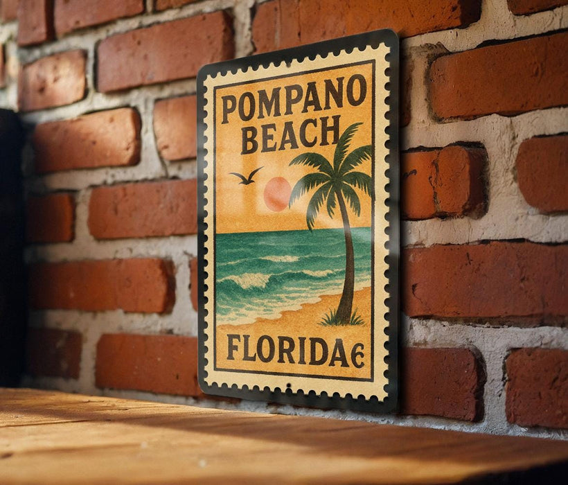 A vintage-style metal sign with the text "POMPAO BEACH FLORIDA" is displayed on a brick wall.
