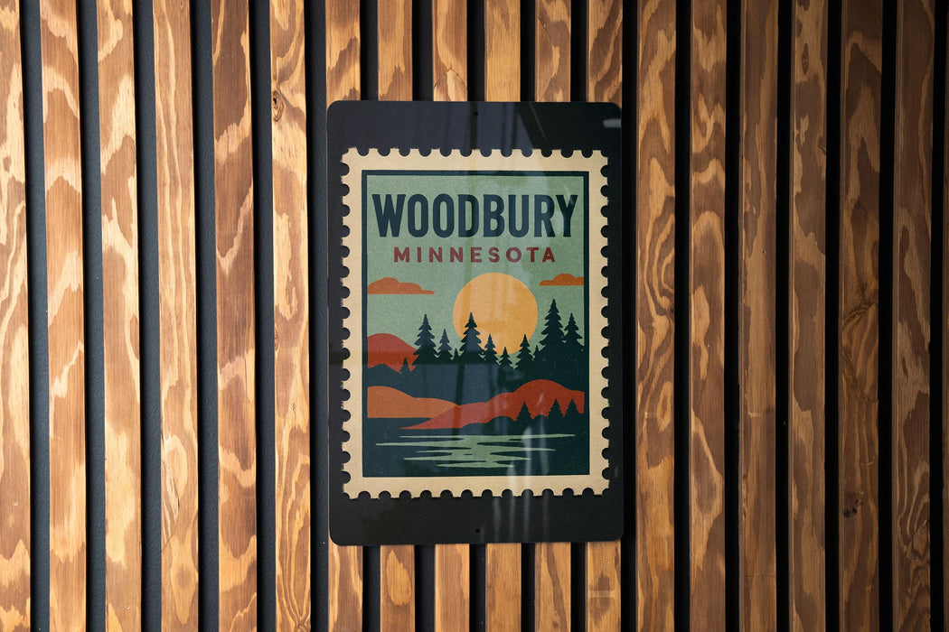 A vintage-style stamp or sign with the text "WOODBURY MINNESOTA" displayed on a wooden wall.