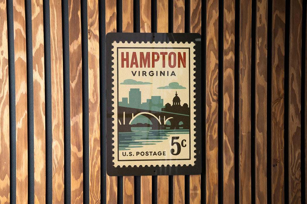 A vintage postage stamp from the United States of America, featuring the city of Hampton, Virginia, with a bridge and water in the background.