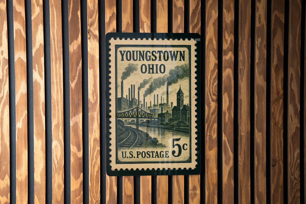 A U.S. postage stamp from Youngstown, Ohio, featuring an illustration of a steam-powered train and industrial buildings.