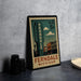 A vintage-style postage stamp from the United States, featuring an illustration of a cityscape with a tall building and the text "FERNADELE MICHIGAN".