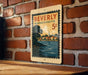 A vintage postage stamp from Beverly Massachusetts, featuring a scenic landscape with a river and houses, is displayed on a brick wall.