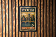 A vintage postage stamp from New York featuring a cityscape and a bridge.