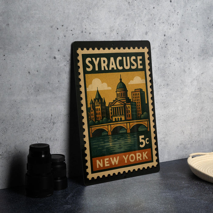 A vintage postage stamp from New York, featuring an illustration of the city skyline and a bridge, placed on a table.