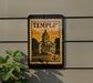 A framed image of a building, likely a historic landmark, mounted on a wall.