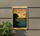 A vintage-style postage stamp from Beverly, Massachusetts, featuring a scenic landscape with a river and buildings, mounted on a wall.