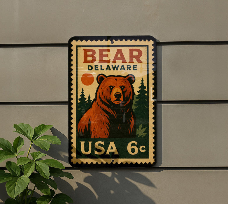 A vintage-style postage stamp featuring a large brown bear, with the text "BEAR DELAWARE" and "USA 6c" printed on it.