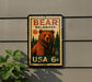 A vintage-style postage stamp featuring a large brown bear, with the text "BEAR DELAWARE" and "USA 6c" printed on it.