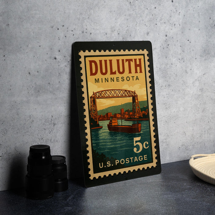 A vintage postage stamp from Duluth, Minnesota, featuring a bridge and boats on the water.