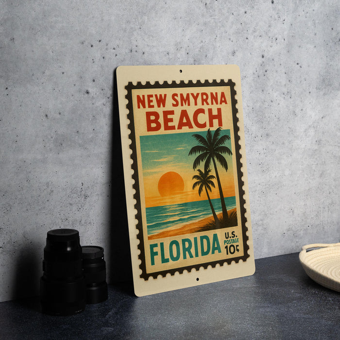 A vintage-style stamp depicting the beach town of New Smyrna Beach, Florida, with a palm tree and sunset in the background.