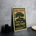 A vintage-style stamp depicting Oak Park, Illinois, with a house and tree illustration, placed on a gray surface next to some black camera lenses.