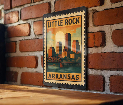 A vintage-style metal stamp depicting a city skyline with a bridge, mounted on a brick wall.