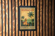 A vintage postage stamp from Puerto Rico featuring a tropical landscape with palm trees and a church.