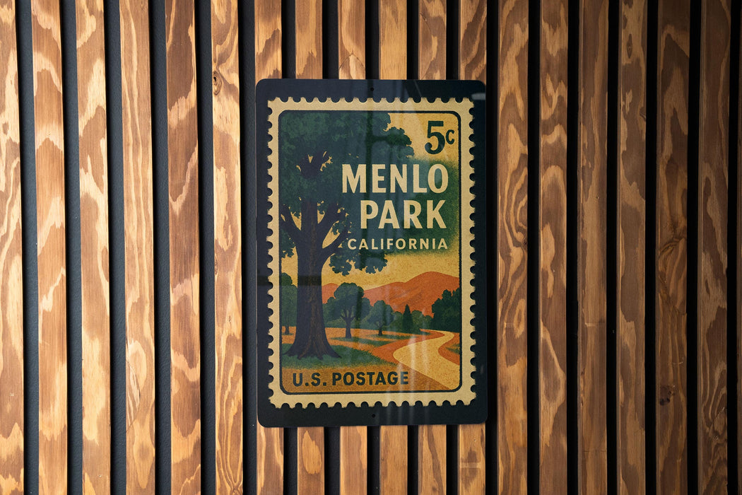 A vintage U.S. postage stamp from Menlo Park, California, featuring a scenic landscape with a tree and mountains.