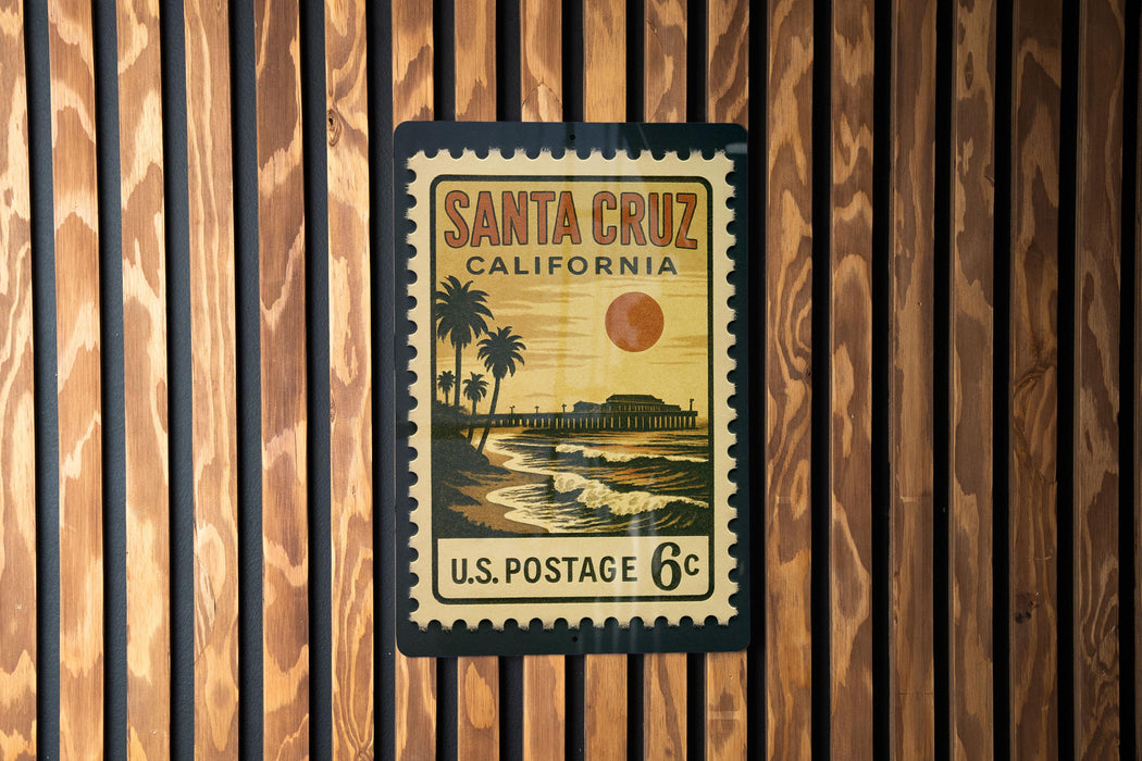 A vintage postage stamp from Santa Cruz, California, featuring a beach scene with palm trees and a sunset.