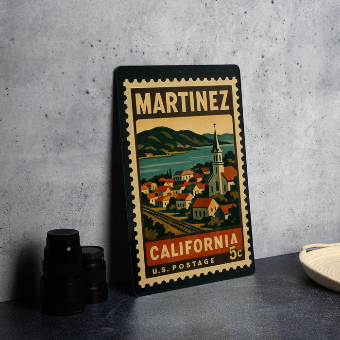 A vintage-style postage stamp from the United States, featuring an illustration of a town on the front and the text "MARTINIZ CALIFORNIA 5¢ U.S. POSTAGE" printed on it.