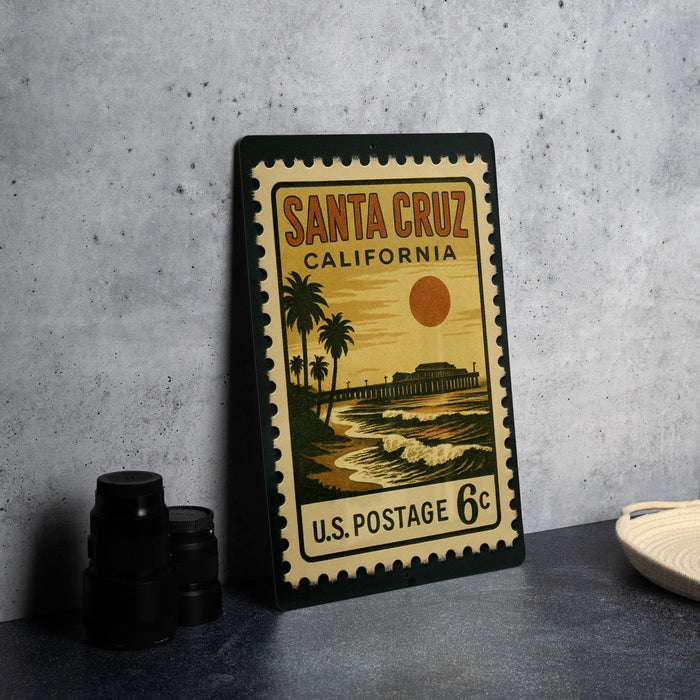 A vintage postage stamp from Santa Cruz, California, featuring a beach scene with palm trees and a pier.