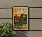 A vintage Puerto Rico postage stamp is displayed on a wall, featuring a colorful illustration of a coastal town.