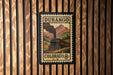 A vintage postage stamp from Durango, Colorado, featuring a steam locomotive on a mountain landscape.