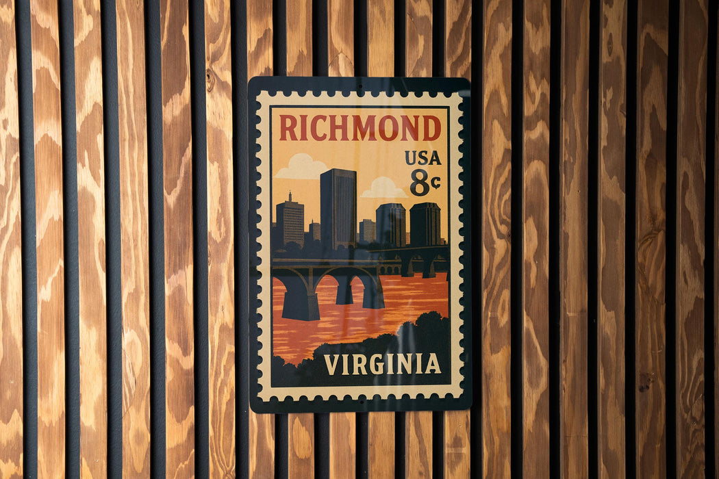 A vintage postage stamp from Virginia, featuring a cityscape and a bridge, is displayed on a wooden wall.