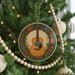 A Christmas tree decorated with a guitar ornament, beads, and other ornaments.