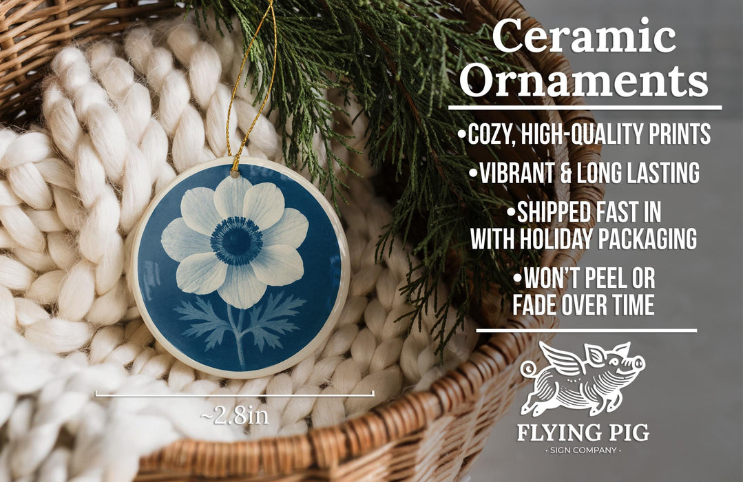 Ceramic ornaments, featuring a blue and white floral design, are displayed in a woven basket.