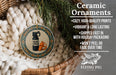 Ceramic ornaments, featuring a bear spray bottle and a whistle, are displayed in a woven basket.