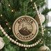 A circular ornament on a Christmas tree, featuring the text "BOGOTA COLOMBIA" and an illustration of a building.