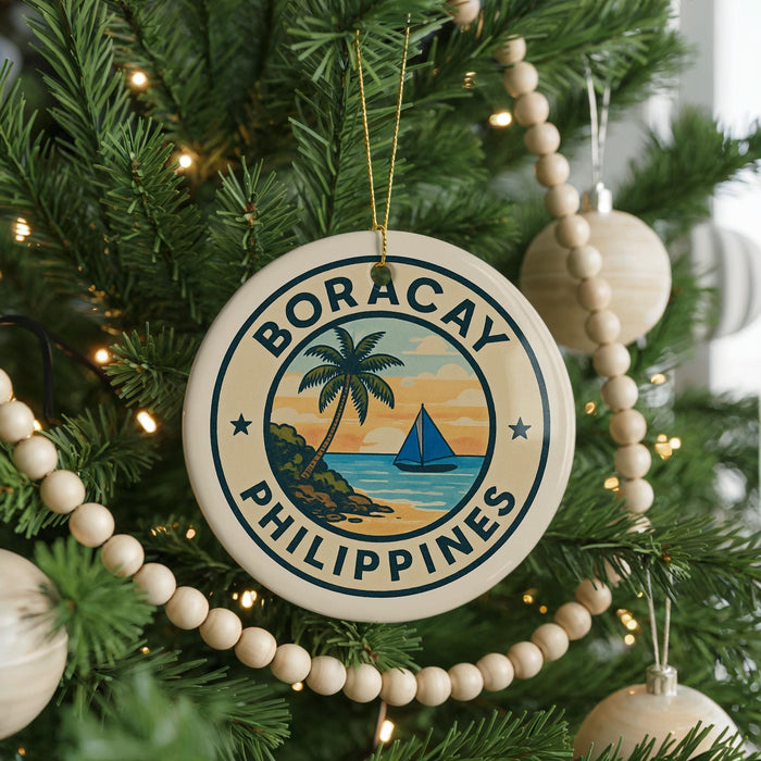 A round ornament on a Christmas tree with the text "BORACAY PHILIPPINES" and a palm tree design.