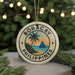 A round ornament with the text "BORACAY PHILIPPINES" and a palm tree design, hanging from a string.