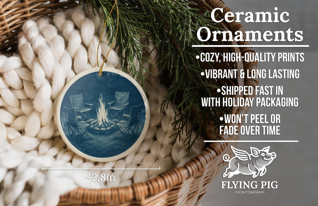 Ceramic ornaments, featuring a blue and white design with a fire pit and chairs, are displayed in a woven basket.