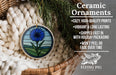 Ceramic ornaments, featuring a blue flower design, are displayed in a woven basket.
