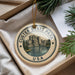 A decorative ornament with the text "CUSTER STATE PARK USA" and an illustration of a mountain landscape, hanging from a string.