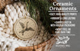 a ceramic ornament hanging from a wicker basket, with a pine branch and greenery in the background.