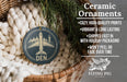 Ceramic ornaments, featuring a blue circular ornament with a white airplane and the word "DEN" printed on it, hanging from a wicker basket.