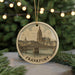 A round ornament featuring a drawing of the city of Frankfurt, Germany, with a bridge and a cathedral in the background.