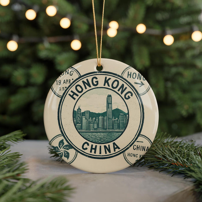 A decorative ornament featuring a circular design with the text "HONG KONG CHINA" and a silhouette of Hong Kong skyline.