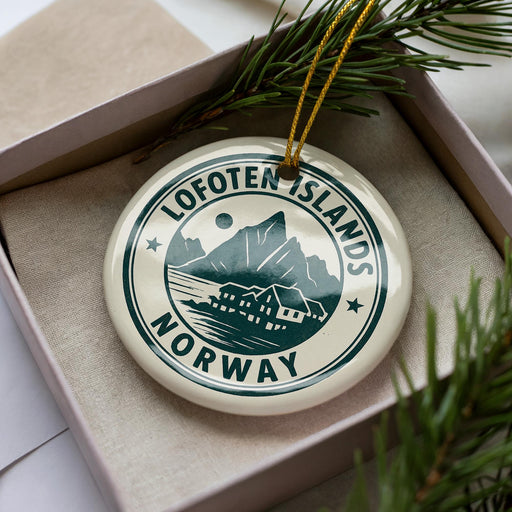 A circular ornament with the text "Lofoten Islands NORWAY" printed on it, surrounded by pine branches.
