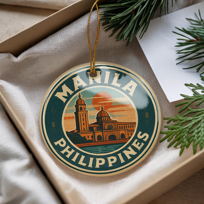 A circular ornament with the text "MANILA PHILIPPINES" and an illustration of a building, hanging from a string.