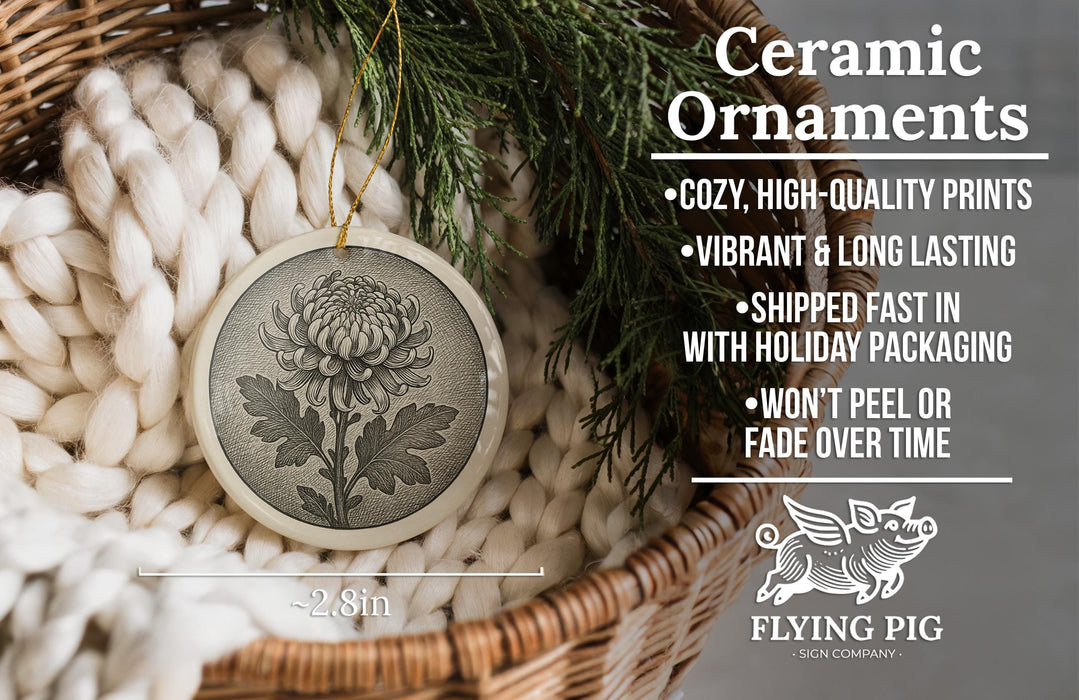 Ceramic ornaments, featuring a black and white image of a flower on a round ceramic piece, are displayed in a woven basket.