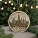 A circular ornament featuring an illustration of the Canadian Parliament building in Ottawa, with the text "Ottawa, Canada" prominently displayed.