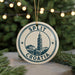 A circular ornament with the text "SPLIT" and "CROATIA" printed on it, featuring an illustration of a building with a clock tower.
