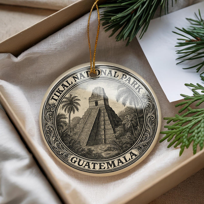 A decorative ornament featuring a temple or pyramid surrounded by palm trees, with the text "Tikal National Park Guatemala" on it.