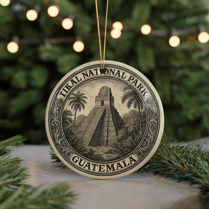 A circular ornament featuring a temple and palm trees, with the text "Tikal National Park Guatemala" around the edge.