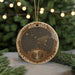 A circular ornament with a bear and a starry night sky design, featuring the text " Ursa Major" and a waterfall image.