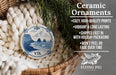 Ceramic ornaments, featuring a blue and white design depicting a coastal scene with a castle, are displayed in a woven basket.