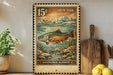 A framed postage stamp depicting a salvelinus alpinus, a type of fish, is displayed on a shelf next to a wooden cutting board and a potted plant.
