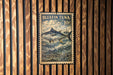 A postage stamp featuring a bluefin tuna fish, with the text "BLUEFIN TUNA 10c" and "THUNNUS THYNNUS" printed on it. The stamp is displayed on a wooden wall with vertical slats.