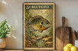 A framed print of a bluegill fish is displayed on a shelf, surrounded by kitchen utensils and a potted plant.