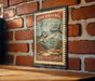 A vintage-style metal stamp featuring a fish, likely a Mackerel, against a brick wall background.
